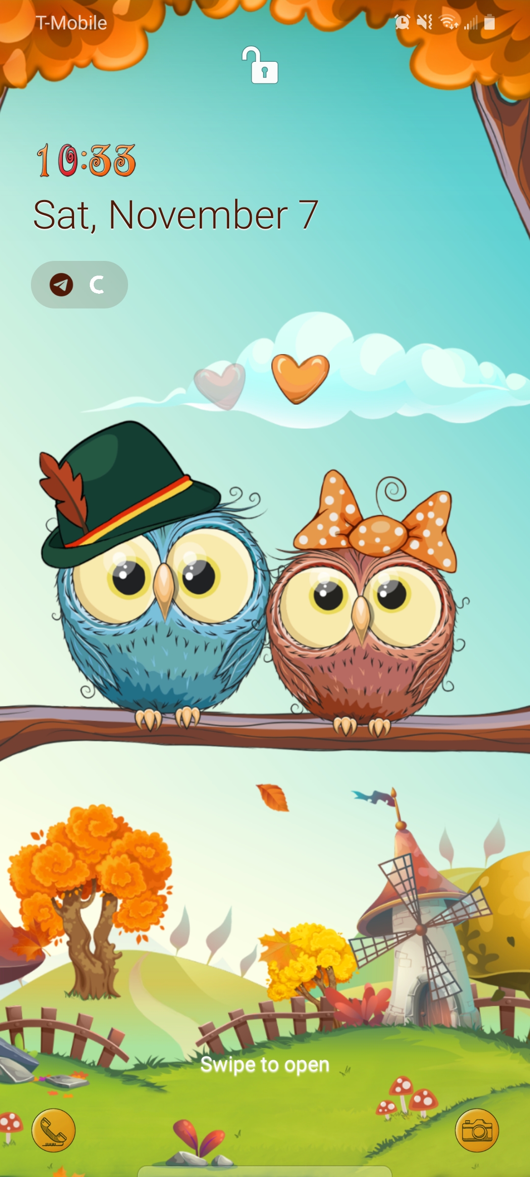 Picture of two owls wearing formal wear sitting in a tree
