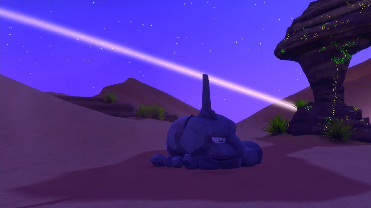Picture taken in New Pokemon Snap, showing Onix sleeping in the desert as a Minior behind it hits the ground like a shooting star
